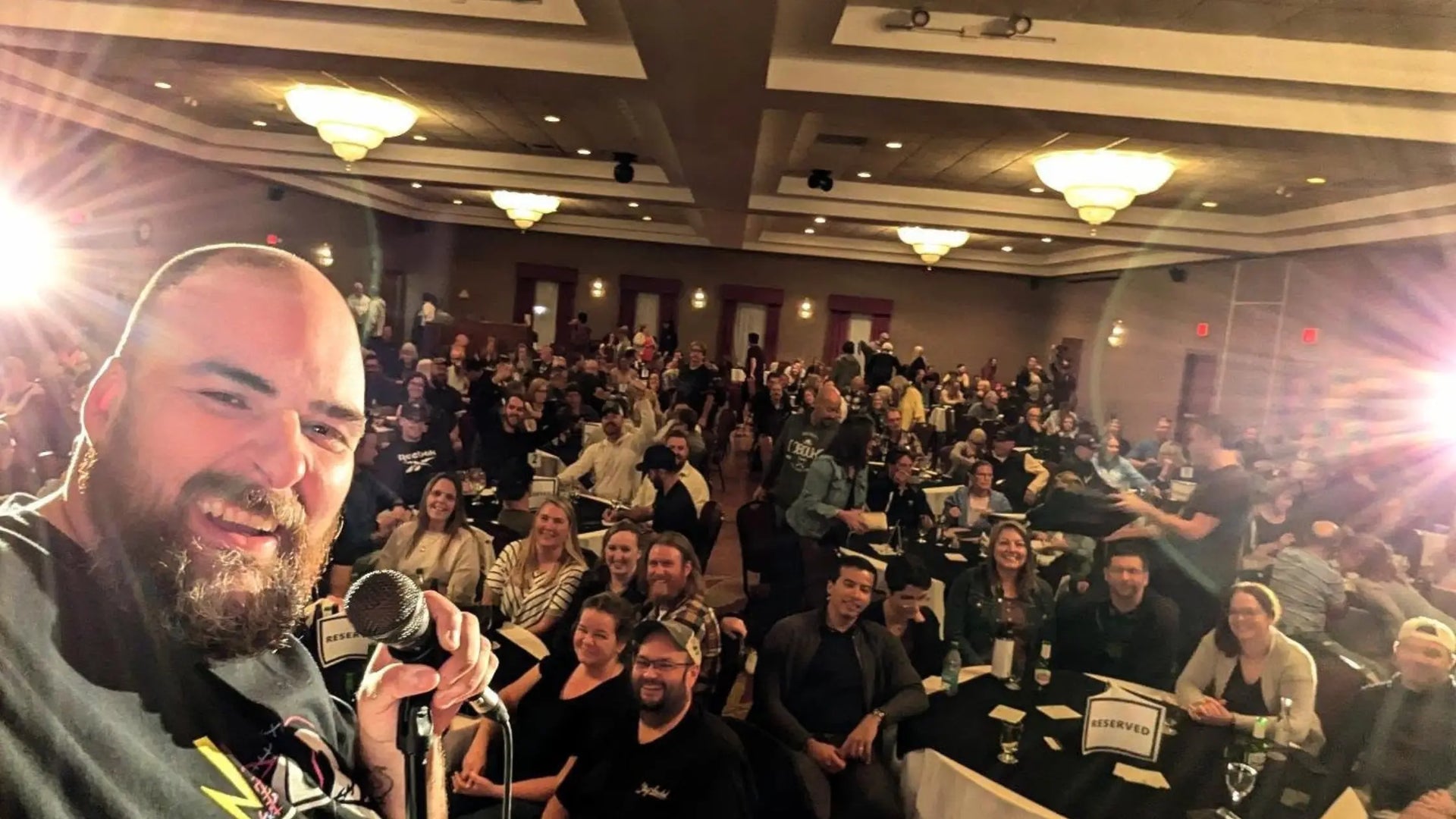 Clifford Myers performing comedy at a corporate event